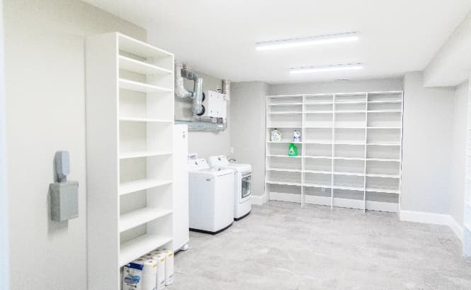 PL-Lyons-homepage-build2 bright, white, light and large laundry room with shelves